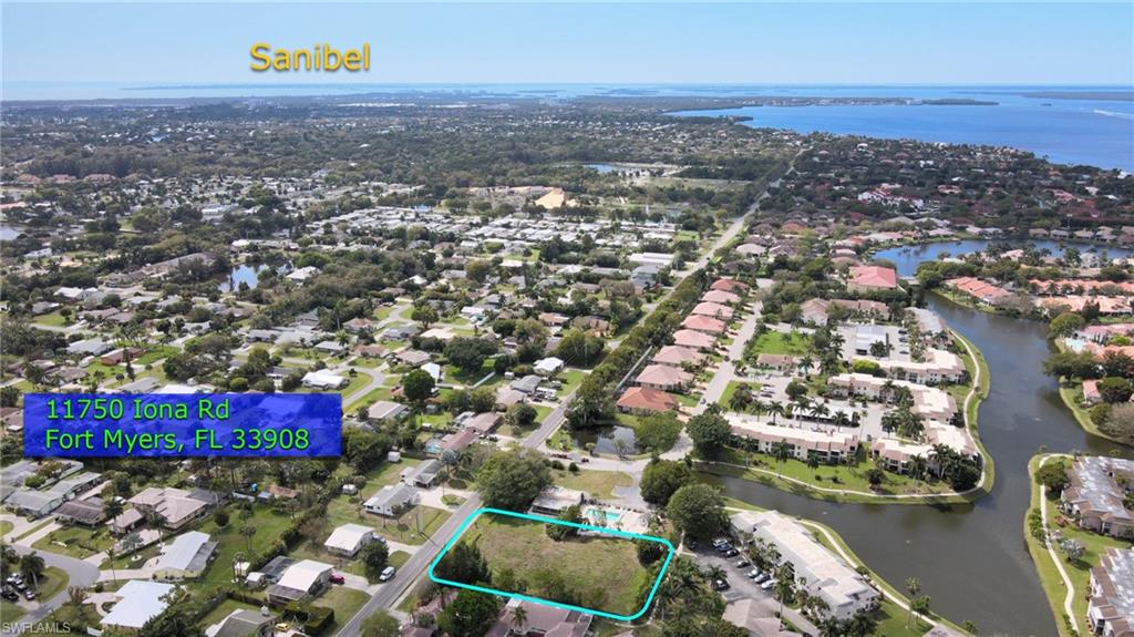 11750 Iona Road Fort Myers, FL 33908 - Photo 3 of 13 an aerial view of residential building and lake