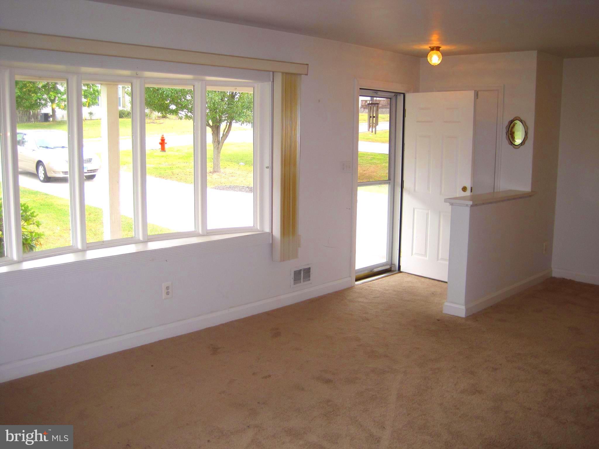 10012 Magledt Road Baltimore, MD 21234 - Photo 4 of 18 LIVING ROOM FEATURES A HUGE BAY WINDOW!