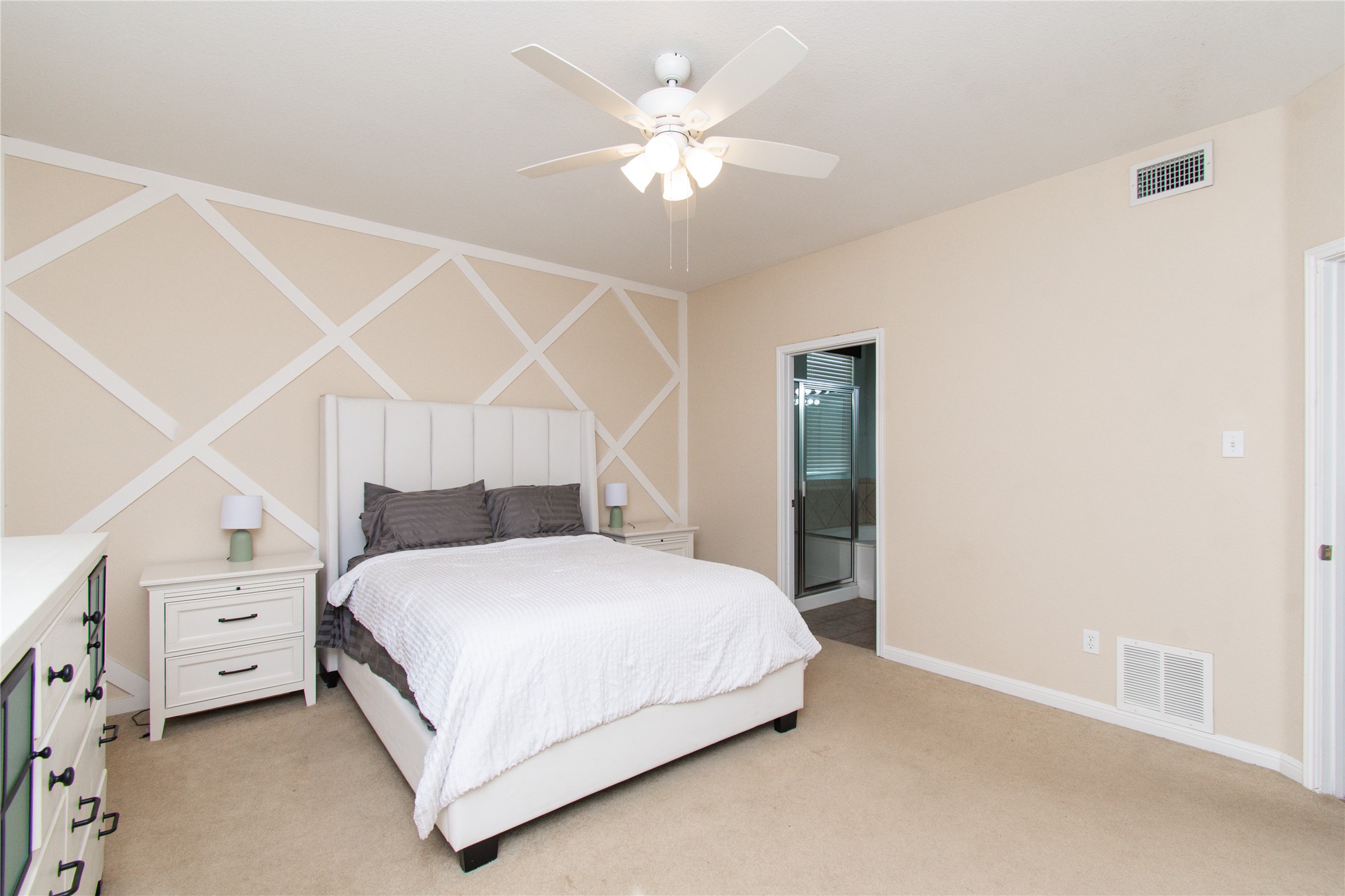 421 Shadow Point San Marcos, TX 78666 - Photo 11 of 24 Bedroom featuring light carpet, connected bathroom, and ceiling fan