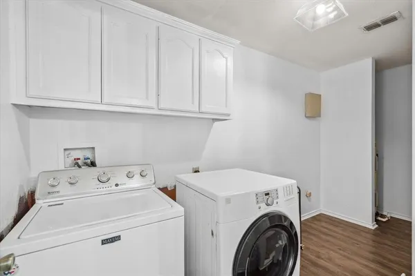 a view of storage and utility room with washer and dryer