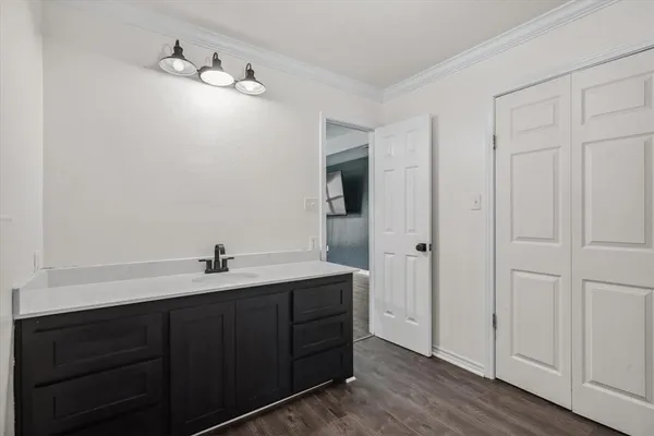 a bathroom with a double vanity sink and mirror