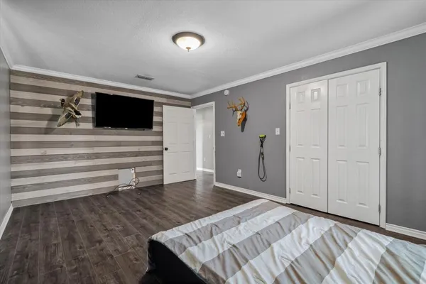a view of a livingroom with wooden floor and closet