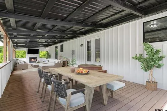 a outdoor dining space with furniture and wooden floor
