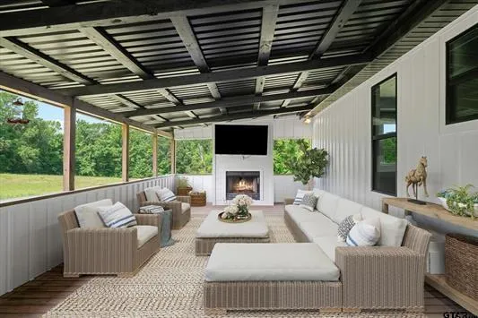 a living room with furniture a fireplace and a table