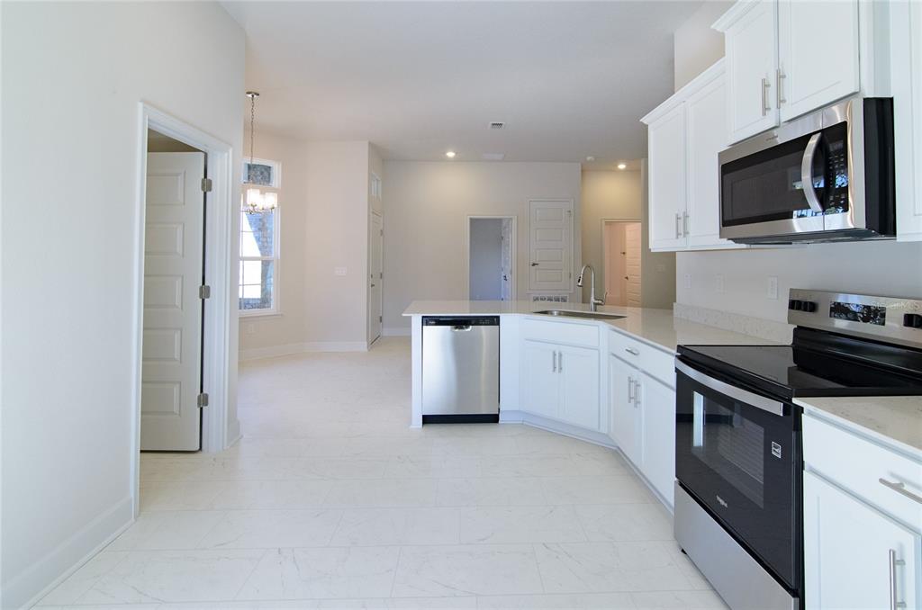 67 Sedgwick Trail Palm Coast, FL 32164 - Photo 12 of 27 a kitchen with a sink and stainless steel appliances