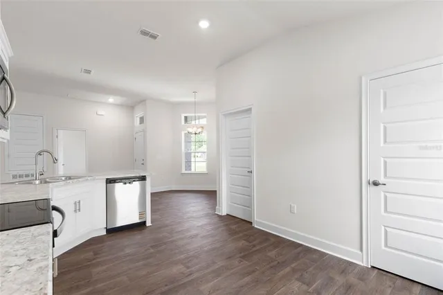 a view of a kitchen with a sink and a window