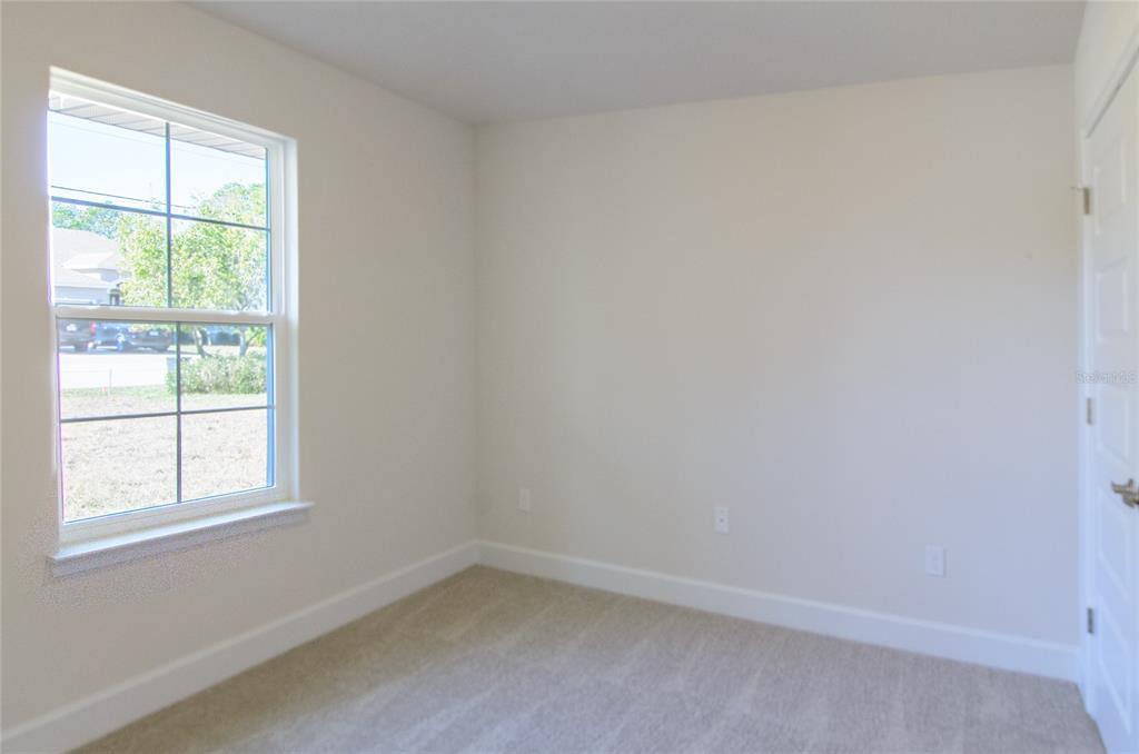 67 Sedgwick Trail Palm Coast, FL 32164 - Photo 16 of 27 an empty room with a window