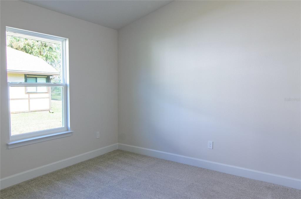 67 Sedgwick Trail Palm Coast, FL 32164 - Photo 19 of 27 an empty room with a window