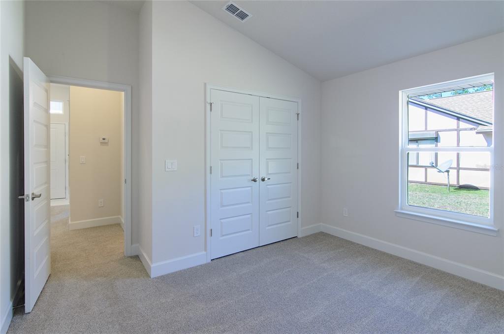 67 Sedgwick Trail Palm Coast, FL 32164 - Photo 20 of 27 an empty room with windows