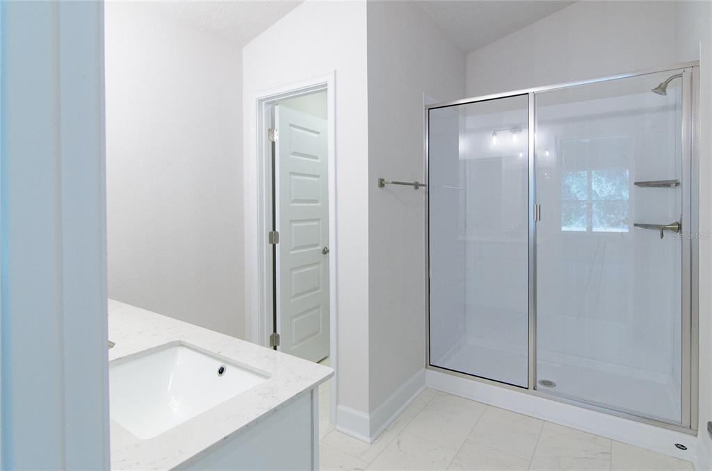 67 Sedgwick Trail Palm Coast, FL 32164 - Photo 22 of 27 a bathroom with a bath tub and shower