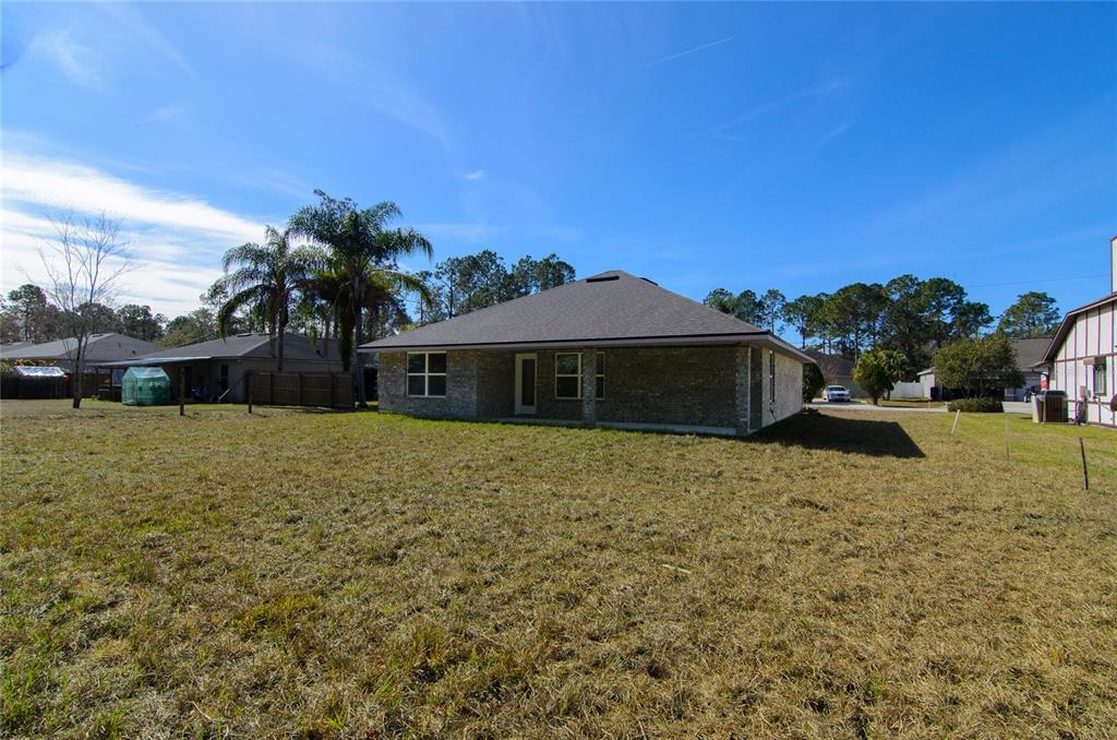 67 Sedgwick Trail Palm Coast, FL 32164 - Photo 27 of 27 a front view of a house with a yard