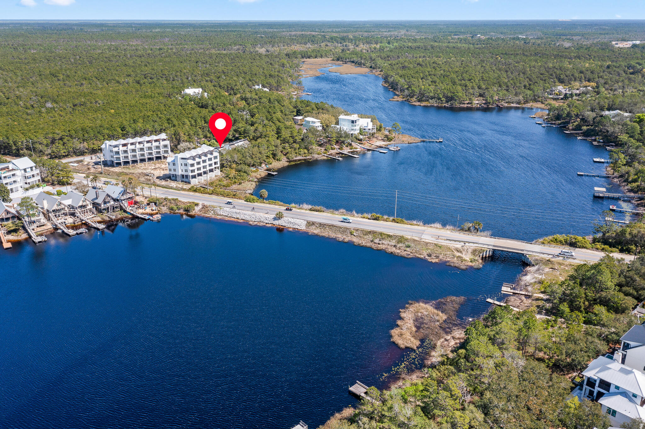 70 North Camp Creek Rd Inlet Beach, Unit 3 Inlet Beach, FL 32461 - Photo 64 of 66 an aerial view of a house with a lake view