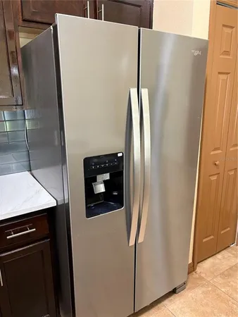 a close view of a refrigerator a washer and dryer