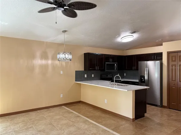 a view of a kitchen with a sink