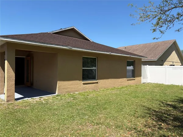 a house with yard in front of it