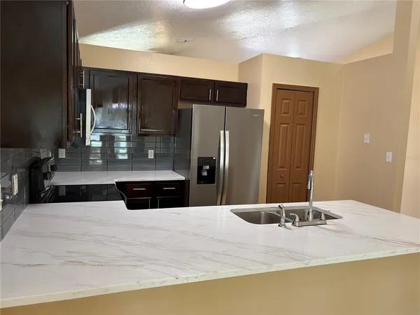 a bathroom with a sink and a large mirror