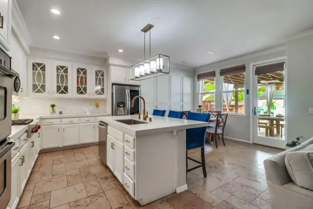 a kitchen with a sink stove and cabinets