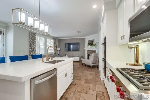 a kitchen with a stove and a sink