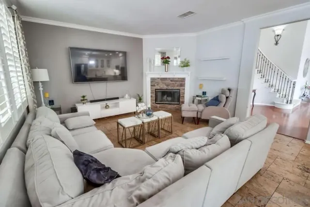 a living room with furniture or couch and a flat screen tv