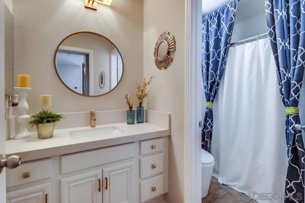 2567 View Trail Court Chula Vista, CA 91914 - Photo 17 of 55 a bathroom with a sink and a mirror