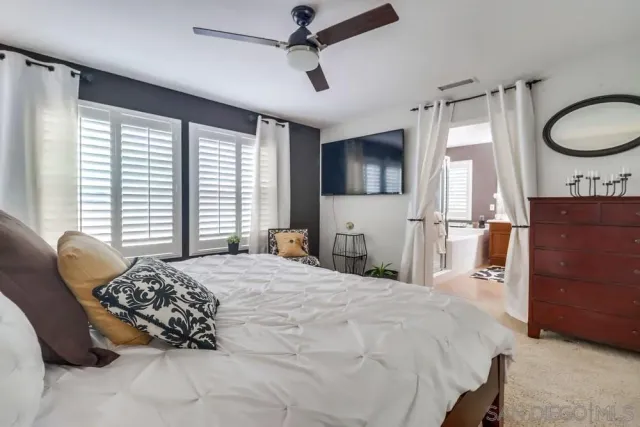 a bedroom with a bed and furniture