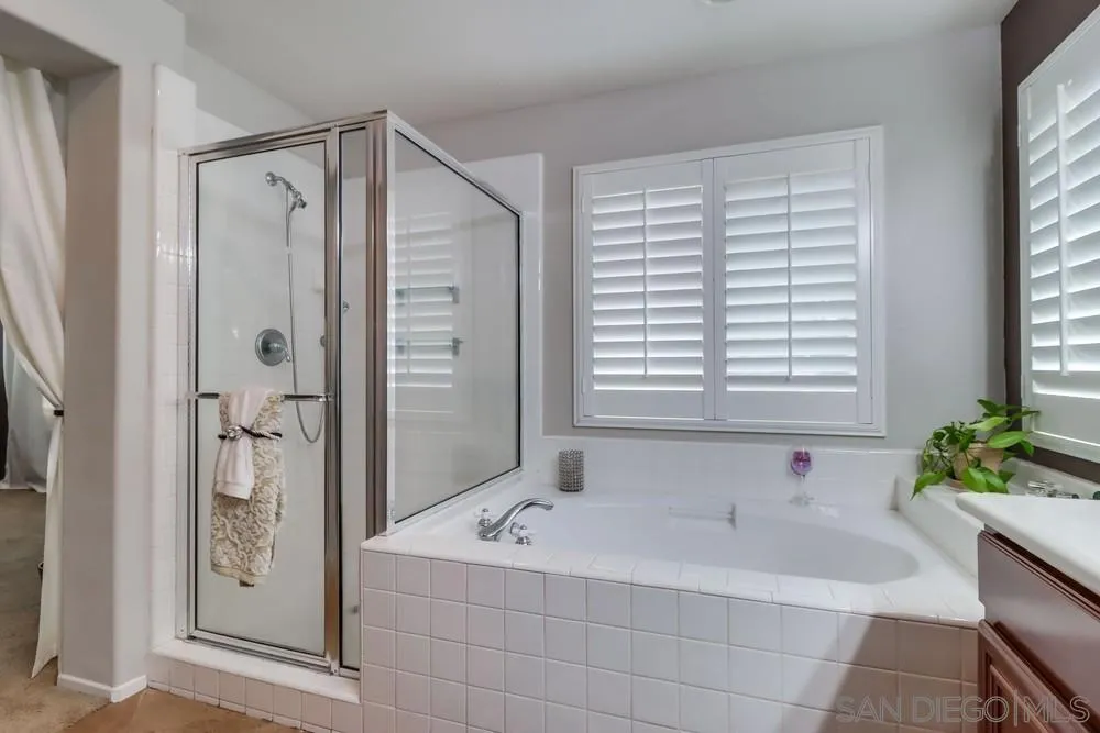 2567 View Trail Court Chula Vista, CA 91914 - Photo 28 of 55 a bathroom with a bathtub and a shower