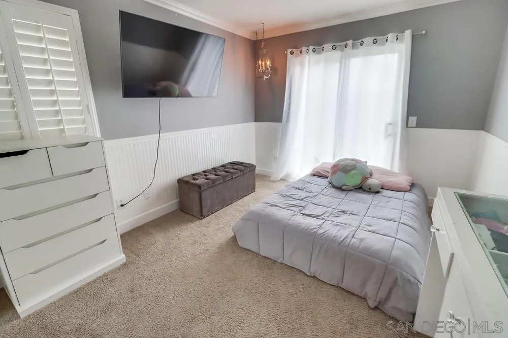 2567 View Trail Court Chula Vista, CA 91914 - Photo 32 of 55 a bedroom with a bed and a flat screen tv