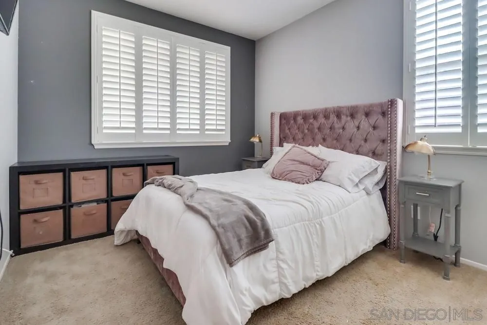 2567 View Trail Court Chula Vista, CA 91914 - Photo 37 of 55 a bedroom with a bed dresser and a window