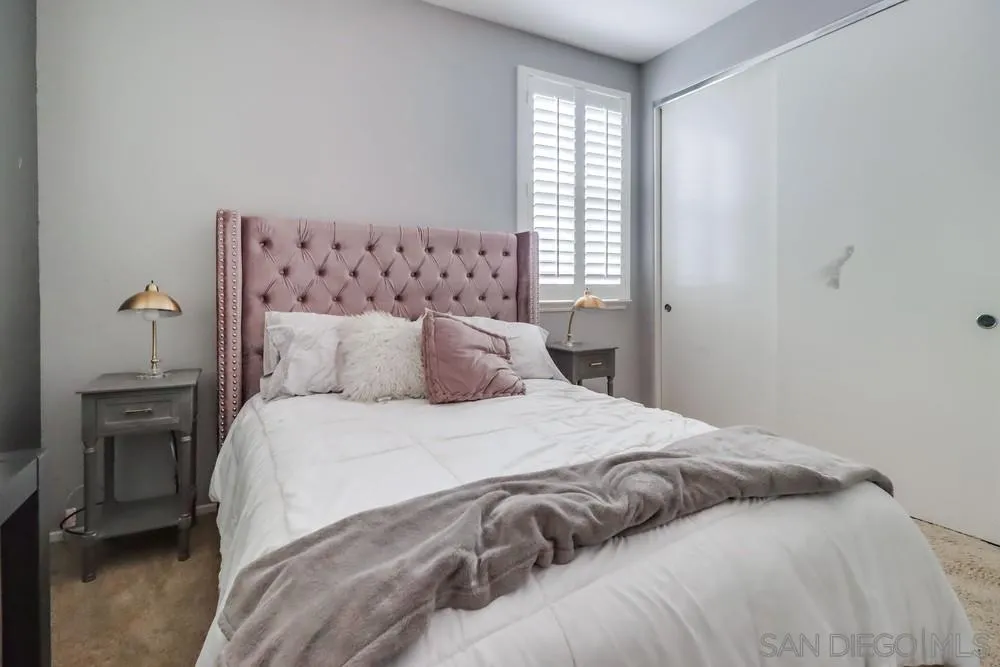 2567 View Trail Court Chula Vista, CA 91914 - Photo 38 of 55 a large bed sitting in a bedroom next to a window