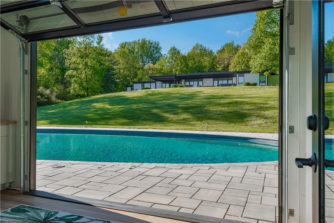 1506 Pleasant View Road Coopersburg, PA 18036 - Photo 89 of 97 An inviting pool alongside a spacious patio with a vast green lawn and mature trees.