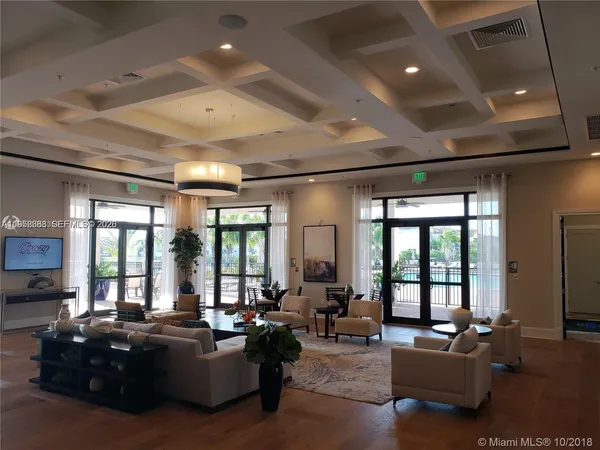 a room with lots of chairs and mirrors