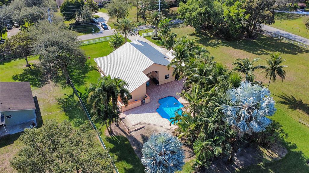 14481 Southwest 20th Street Davie, FL 33325 - Photo 13 of 36 an aerial view of a house with a swimming pool yard and outdoor seating