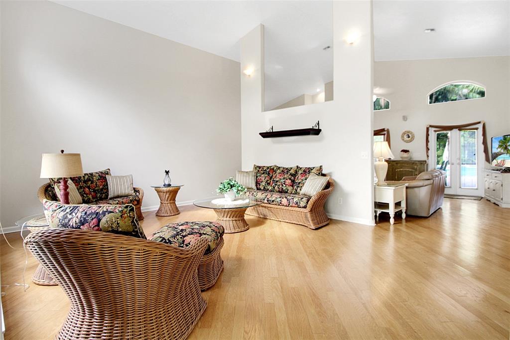 14481 Southwest 20th Street Davie, FL 33325 - Photo 18 of 36 a living room with furniture and a wooden floor