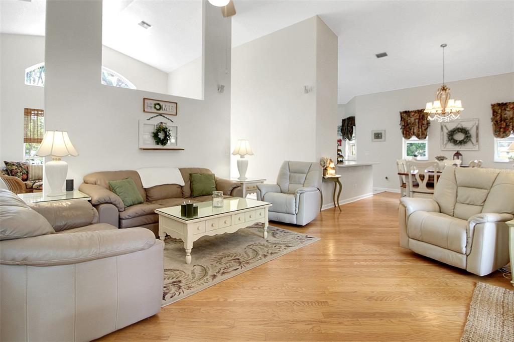 14481 Southwest 20th Street Davie, FL 33325 - Photo 19 of 36 a living room with furniture and a chandelier