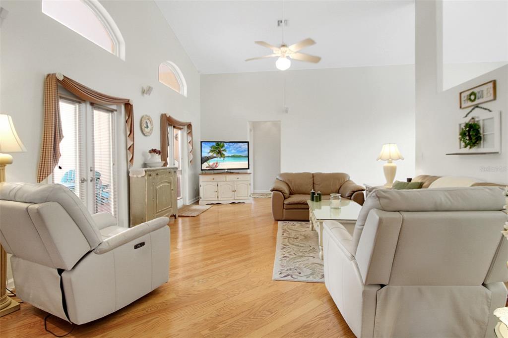 14481 Southwest 20th Street Davie, FL 33325 - Photo 22 of 36 a living room with furniture and a wooden floor