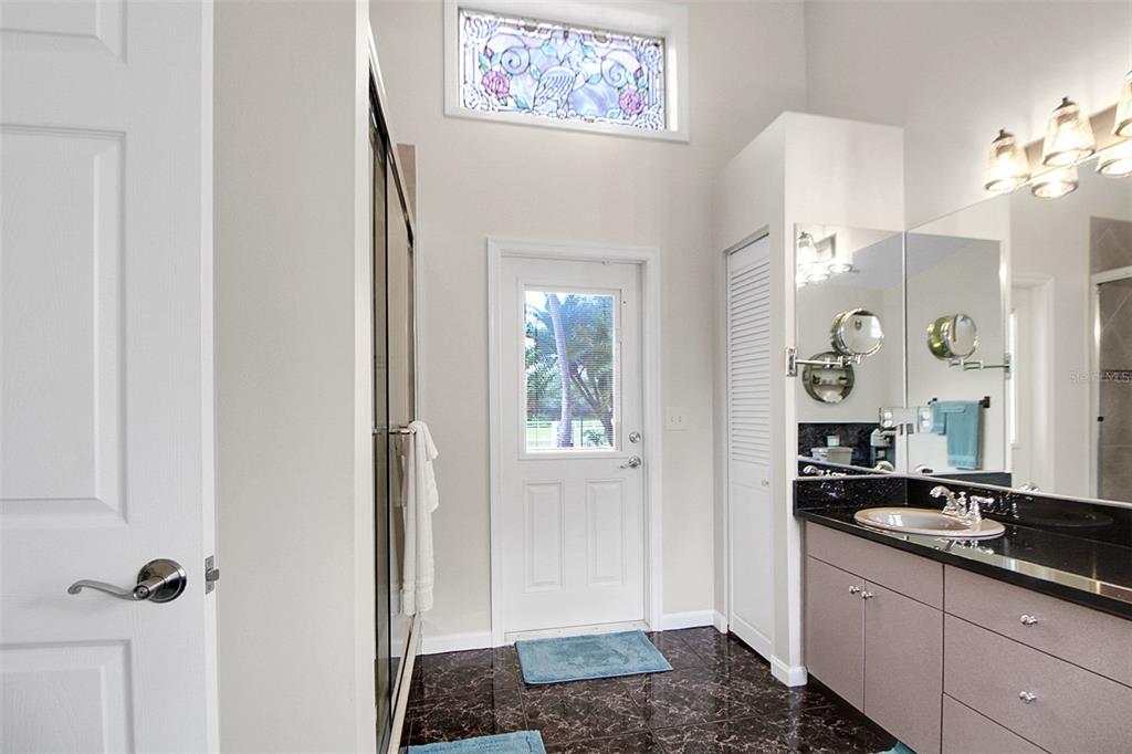 14481 Southwest 20th Street Davie, FL 33325 - Photo 27 of 36 a bathroom with a sink and a mirror