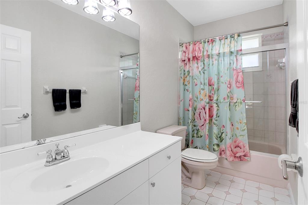 14481 Southwest 20th Street Davie, FL 33325 - Photo 32 of 36 a bathroom with a sink toilet and shower