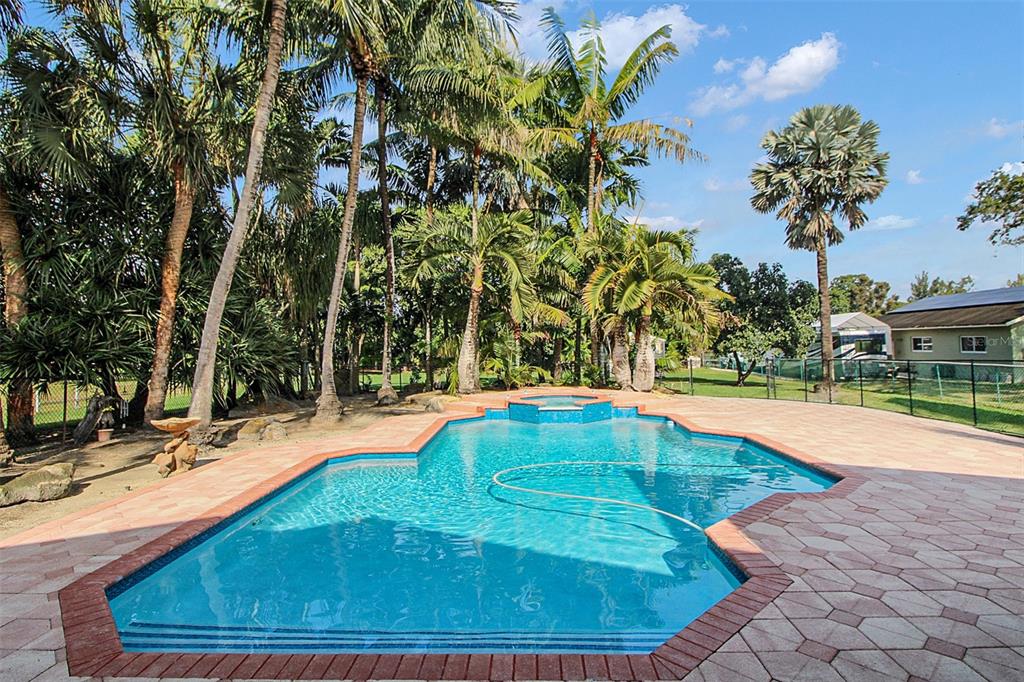 14481 Southwest 20th Street Davie, FL 33325 - Photo 5 of 36 a view of a swimming pool with an outdoor space