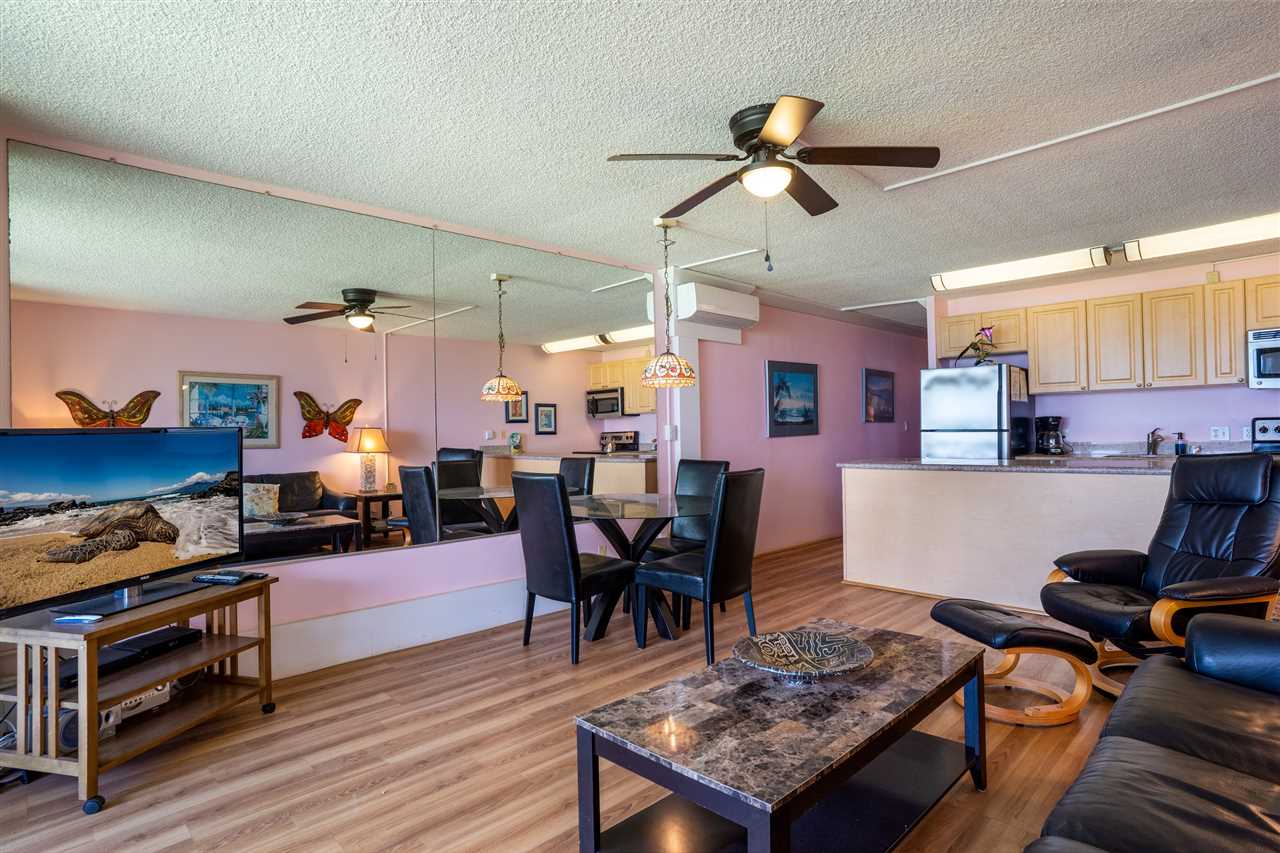 998 South Kihei Road, Unit 304 Kihei, HI 96753 - Photo 11 of 26 a living room with lots of furniture and kitchen view