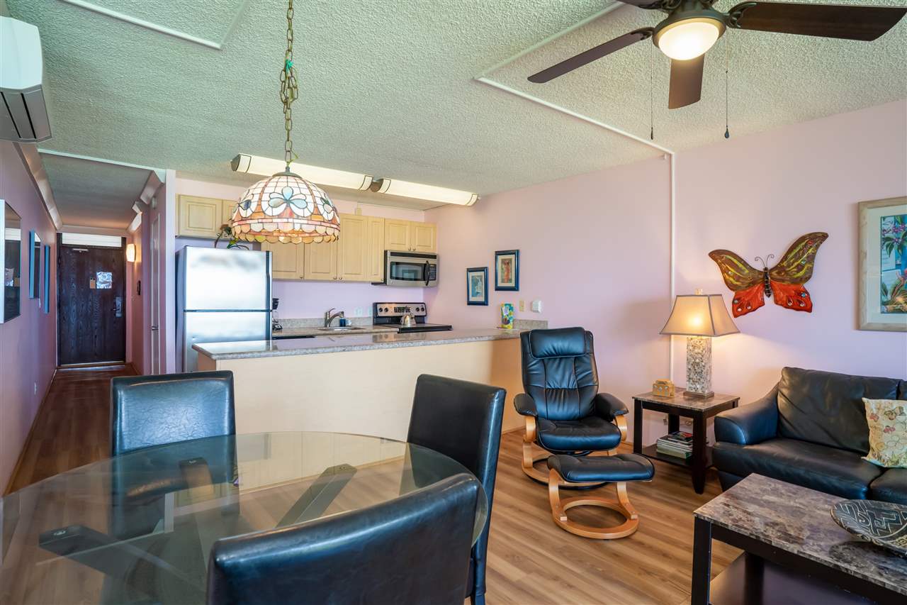 998 South Kihei Road, Unit 304 Kihei, HI 96753 - Photo 12 of 26 a living room with furniture and chandelier