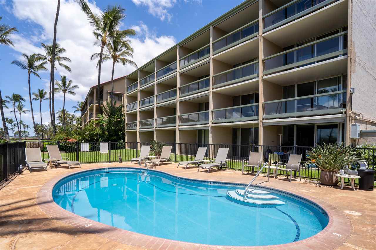 998 South Kihei Road, Unit 304 Kihei, HI 96753 - Photo 2 of 26 a swimming pool with outdoor seating and yard