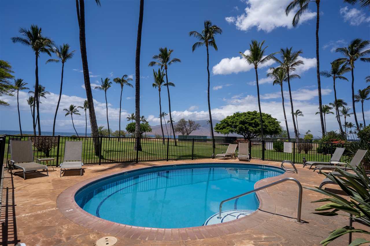 998 South Kihei Road, Unit 304 Kihei, HI 96753 - Photo 25 of 26 a view of a swimming pool with a lounge chairs