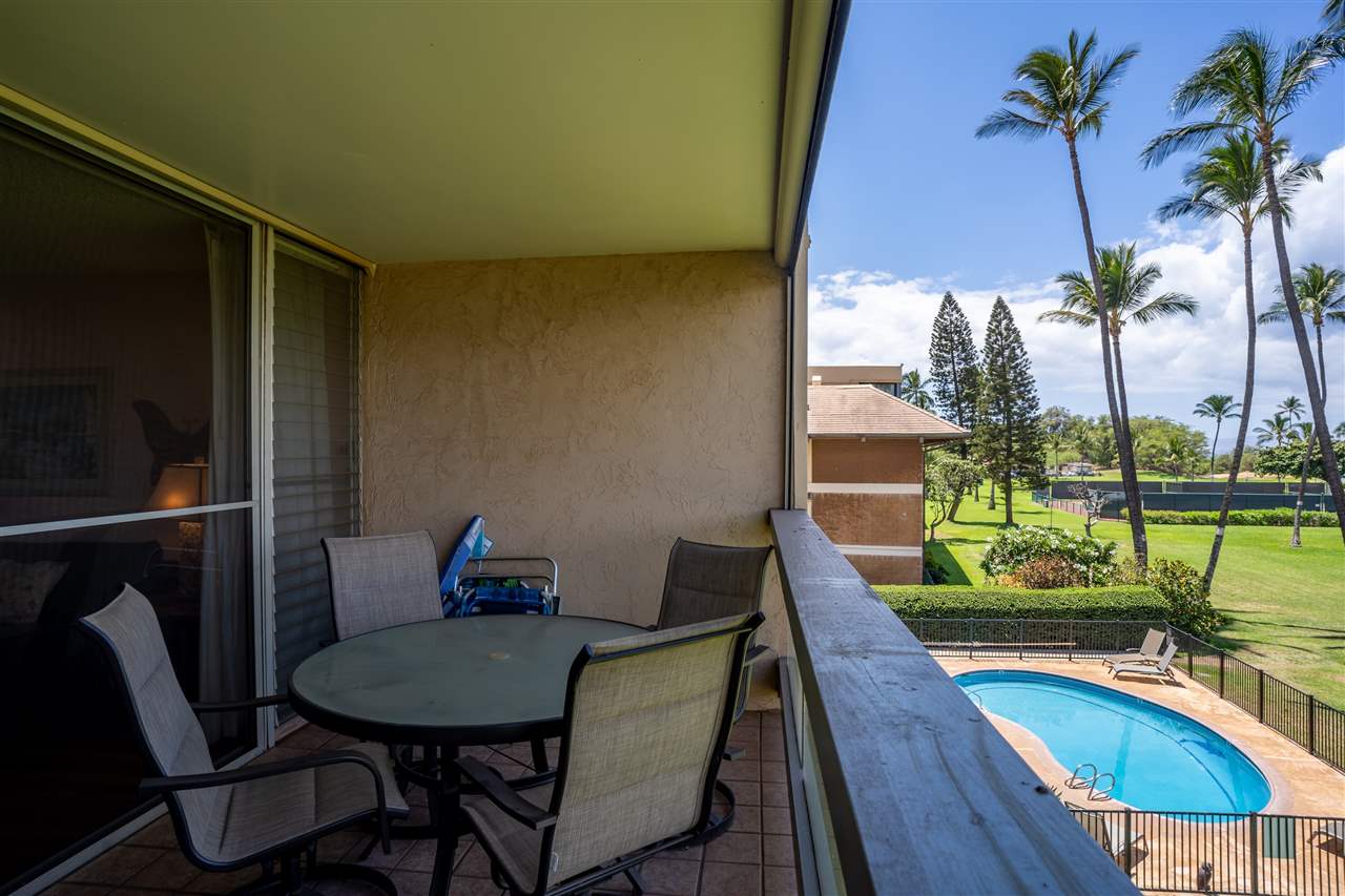 998 South Kihei Road, Unit 304 Kihei, HI 96753 - Photo 6 of 26 a view of a balcony with chairs and a potted plant