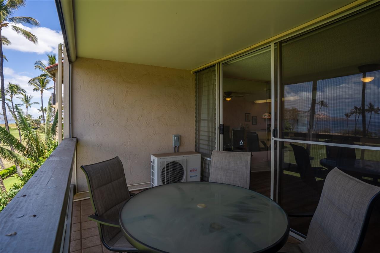 998 South Kihei Road, Unit 304 Kihei, HI 96753 - Photo 7 of 26 a view of a dining room with furniture window and wooden floor