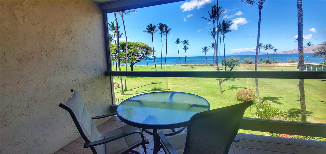 998 South Kihei Road, Unit 304 Kihei, HI 96753 - Photo 8 of 26 a view of a dining room with furniture window and wooden floor