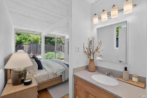 a bedroom with a bed and large window