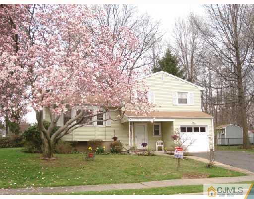 5 Laythan Road Edison, NJ 08817 - Photo 1 of 11 a front view of a house with a yard