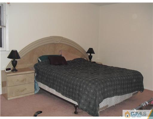 5 Laythan Road Edison, NJ 08817 - Photo 6 of 11 a bedroom with a bed and a dresser
