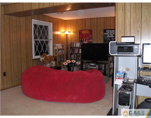 5 Laythan Road Edison, NJ 08817 - Photo 8 of 11 a room with furniture and a flat screen tv