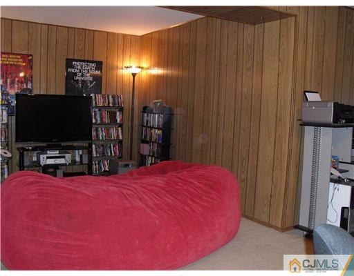 5 Laythan Road Edison, NJ 08817 - Photo 9 of 11 a bedroom with a bed and a flat screen tv